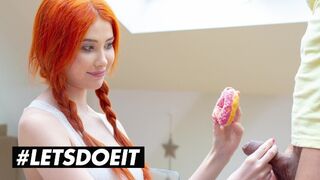 Gisha Forza isorintaisessa punaisessa pommissa kovalla nussimalla donitsia